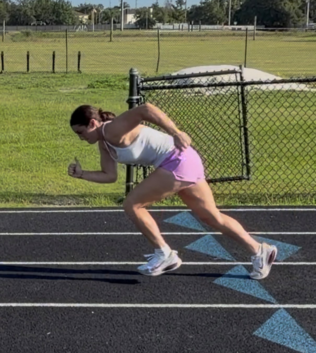 S3 athlete sprinting off the start before training, showing an upright torso and shorter drive angle